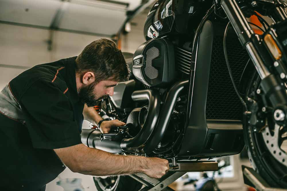 Professional Mechanic Doing Repairs On A Motorbike — All Pro Locksmiths in Port Macquarie, NSW
